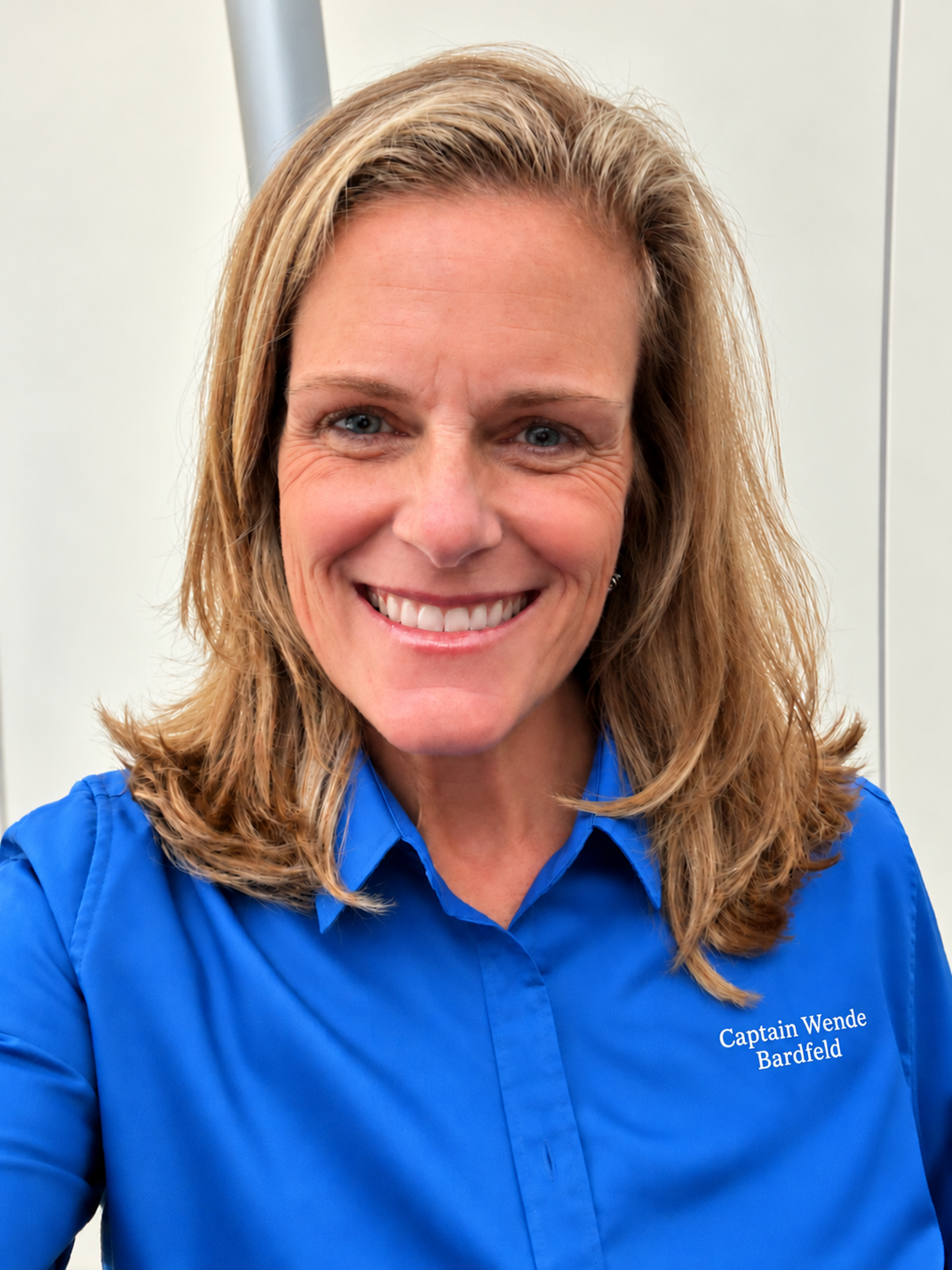 Captain Wende Bardfeld smiling in a blue shirt